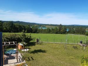 a person standing in a yard with a soccer goal at Gîte les Griffons in Clairvaux-les-Lacs +3 photos