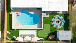 an aerial view of a swimming pool and a resort at Private Pool 6 MI to Clearwater Beach Fire Pit Game Room in Clearwater