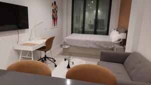 TV a/nebo společenská místnost v ubytování Estudio Ricci-Chamberí