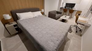 Postel nebo postele na pokoji v ubytování Estudio Ricci-Chamberí + 11 fotografií