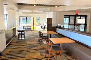 a fast food restaurant with tables and chairs at Fairfield Inn Las Vegas Convention Center in Las Vegas