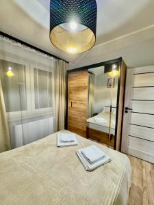 Ένα ή περισσότερα κρεβάτια σε δωμάτιο στο Apartament Oleńka