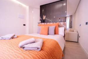 Postel nebo postele na pokoji v ubytování SERAN Apartamentos