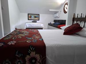 Ένα ή περισσότερα κρεβάτια σε δωμάτιο στο Refúgio Natural com Praia Paradisíaca a 300m