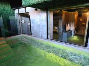 a swimming pool in the middle of a house at BOUTIQUE Hotel ENTRY E in Bansko