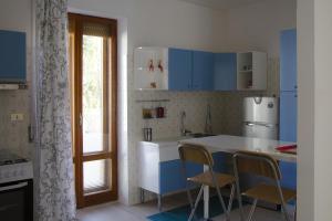 Kuchyňa alebo kuchynka v ubytovaní La Signora Dei Fiori