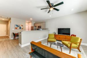 a living room with a couch and a flat screen tv at Near Shopping and Dining Pet-Friendly Dallas Apt! in Gastonia