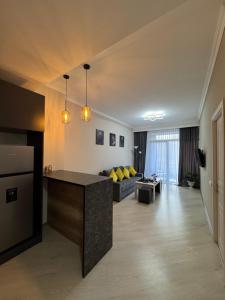 a large living room with a couch and a table at Tsaghkadzor Alvina Complex 12 Project in Tsaghkadzor