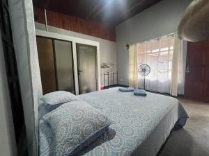 Postel nebo postele na pokoji v ubytování Casa Eva Lodging Costa Rica + 5 fotografií
