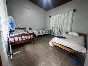 Postel nebo postele na pokoji v ubytování Casa Eva Lodging Costa Rica