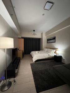 Voodi või voodid majutusasutuse 81 Newport Blvd Cluster 5 Unit 4E by Rechelle Nunag toas