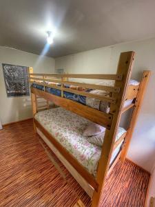a couple of bunk beds in a room at Casa Natales - Dormitorio Privado in Puerto Natales