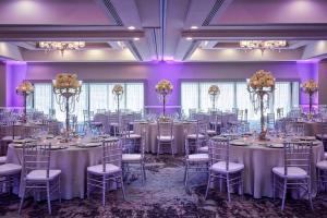 a ballroom with tables and chairs with purple lighting at JW Marriott San Francisco Union Square in San Francisco