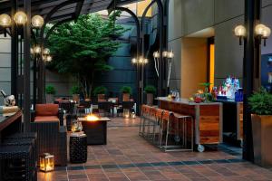 a restaurant with tables and chairs in a building at Renaissance Asheville Downtown Hotel in Asheville