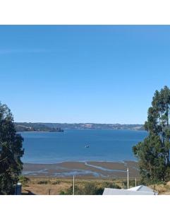 a view of a large body of water at Cabañas vista al mar in Coñico +2 photos
