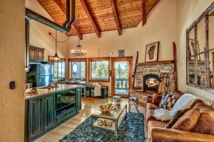 a kitchen and living room with a couch and a fireplace at Mv8 lakeview across from Heavenly in Stateline