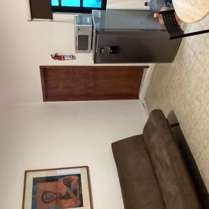 a living room with a couch and a fax machine at Department, Studio Type Excellent Location in Mexico City