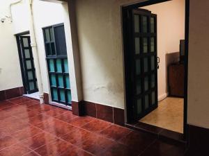 an empty room with two doors and a tile floor at Department, Studio Type Excellent Location in Mexico City