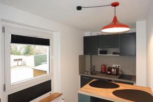 a kitchen with a wooden counter and a window at 501 Comfort Housing in Falkensee