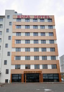 a building with a hotel sign on top of it at Bupa Hotel in Kayseri