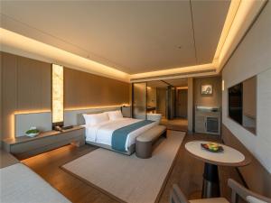 Postel nebo postele na pokoji v ubytování Yibo Jinling Hotel Moganshan