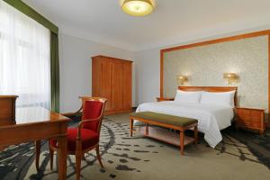 Postel nebo postele na pokoji v ubytování Le Méridien Grand Hotel Nürnberg