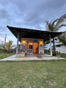 a house with a porch with a roof at PointBreak Resort in Kalpitiya