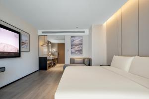 Televiisor ja/või meelelahutuskeskus majutusasutuses Atour Hotel Changsha Middle Furong Road Tujiachong