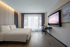 Televiisor ja/või meelelahutuskeskus majutusasutuses Atour Hotel Changsha Middle Furong Road Tujiachong