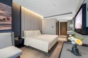 Televiisor ja/või meelelahutuskeskus majutusasutuses Atour Hotel Changsha Middle Furong Road Tujiachong