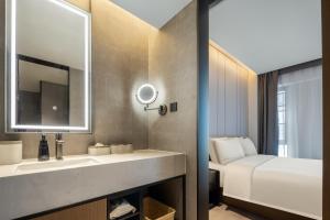 Voodi või voodid majutusasutuse Atour Hotel Changsha Middle Furong Road Tujiachong toas