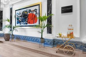 a room with plants and paintings on the wall at Hotel Palacio del Retiro, Autograph Collection in Madrid +81 photos