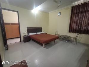 Postel nebo postele na pokoji v ubytování chiranthlodge