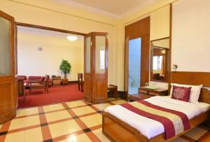 Postel nebo postele na pokoji v ubytování Sea Green Hotel