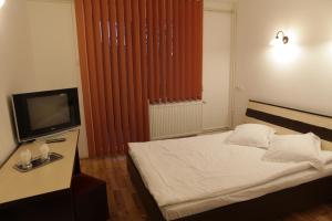 Postel nebo postele na pokoji v ubytování Hotel Romantik
