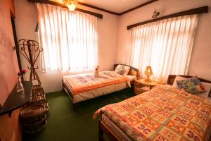 Postel nebo postele na pokoji v ubytování Peace Eye Guest House