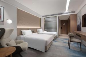 En eller flere senger på et rom på Doubletree By Hilton Altay Fuyun
