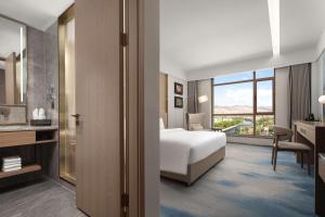 En eller flere senger på et rom på Doubletree By Hilton Altay Fuyun