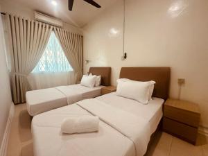 Postel nebo postele na pokoji v ubytování Alana Guesthouse
