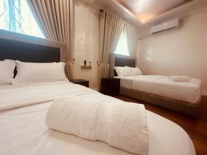 Postel nebo postele na pokoji v ubytování Alana Guesthouse