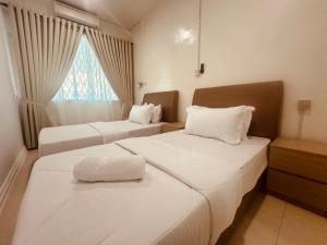 Postel nebo postele na pokoji v ubytování Alana Guesthouse