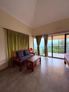 Postel nebo postele na pokoji v ubytování Atithi HomesStay, Vandiperiyar ,Thekkady