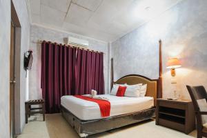 Voodi või voodid majutusasutuse RedDoorz Plus @ Jalan Raden Intan Lampung toas