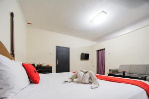 Voodi või voodid majutusasutuse RedDoorz Plus @ Jalan Raden Intan Lampung toas