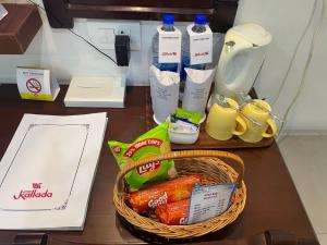 a basket of food and drinks on a table at Kallada Sangeetha Hotels in Trichūr