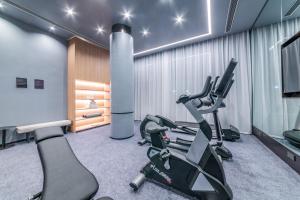 a gym with tread machines in a room at Atour Hotel Panzhihua East District Jinhai Century City in Panzhihua