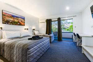 Postel nebo postele na pokoji v ubytování Aaron Motel + 5 fotografií