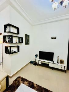 TV a/nebo společenská místnost v ubytování Essentiel 2 + 3 fotografie