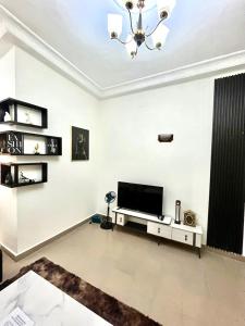 TV a/nebo společenská místnost v ubytování Essentiel 2