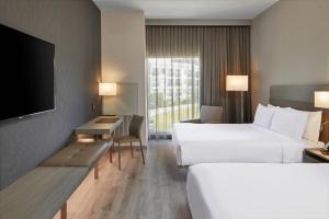 Postel nebo postele na pokoji v ubytování AC Hotel by Marriott Durham Duke University